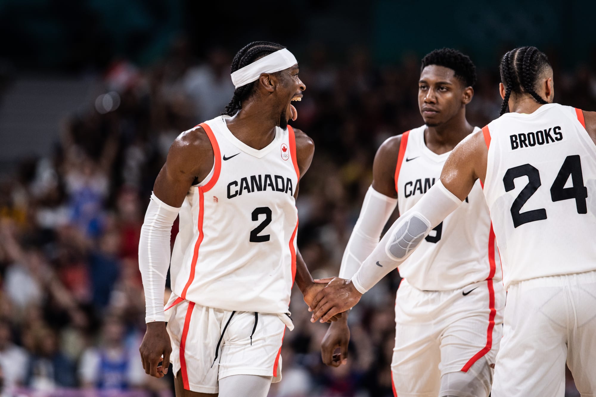 Canada survive a late comeback, eliminate Spain, remain perfect