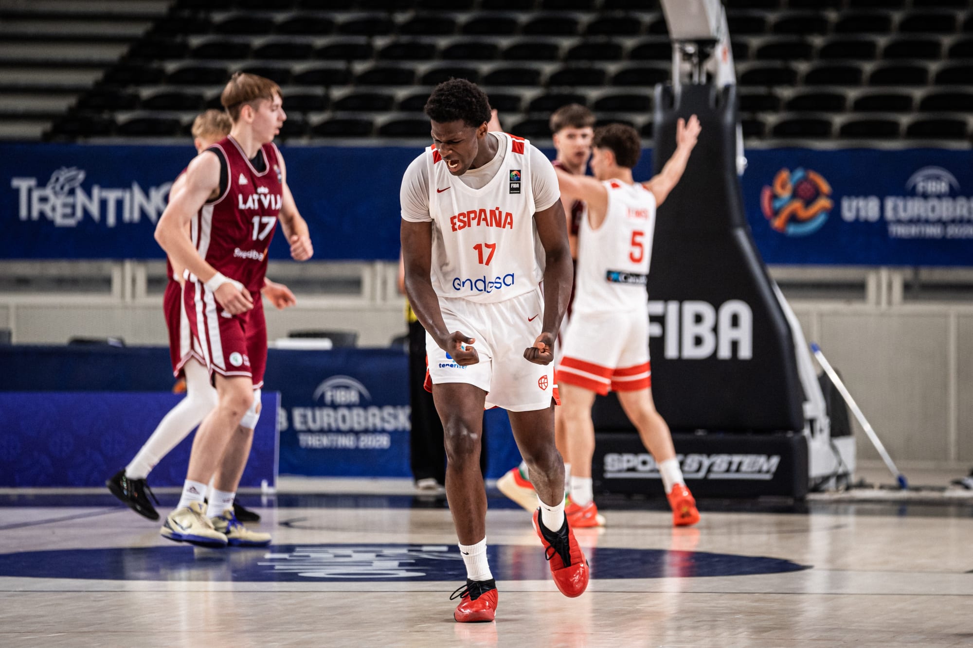 Reigning champs Spain survive Latvia fight, Round of 16 matchups set